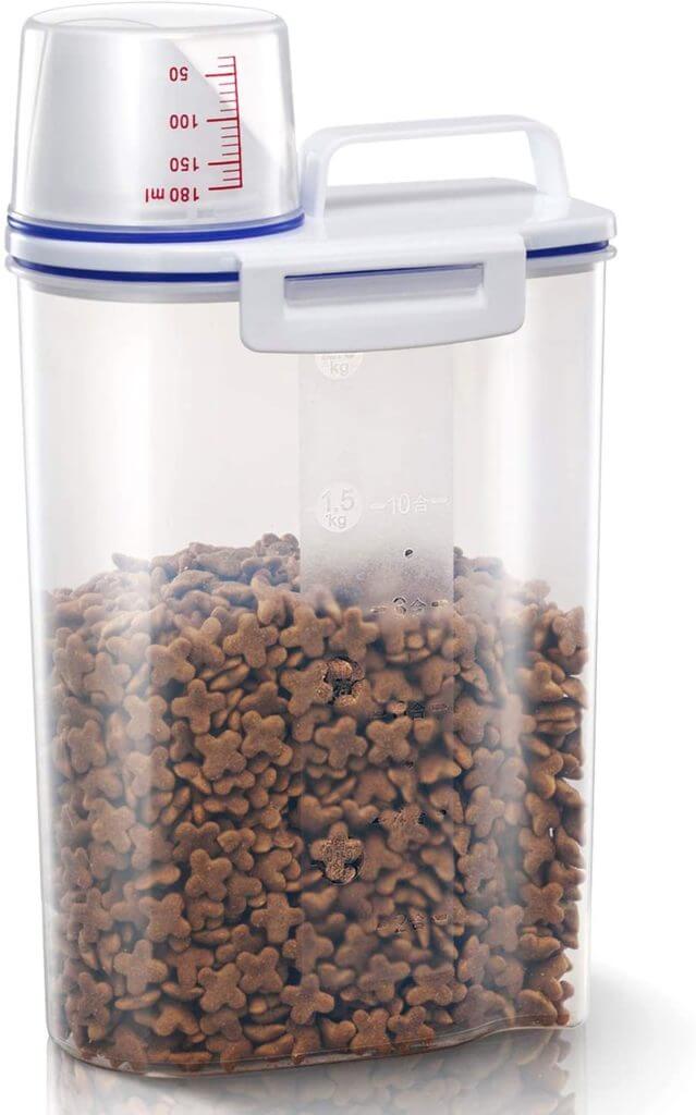 Image of a rabbit pellet storage container with measuring cup.